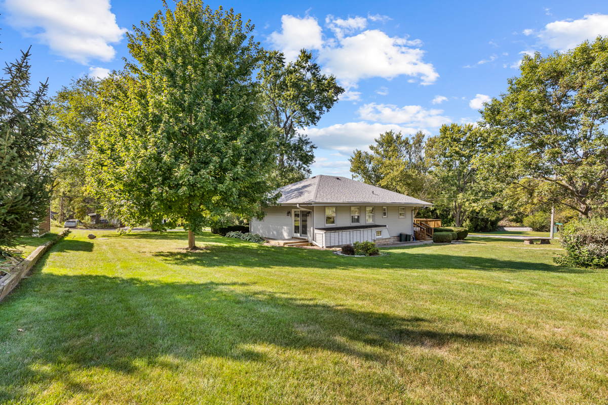18633 Main Street Mokena, IL 60448 - Photo 5 of 24 a view of a house with a big yard