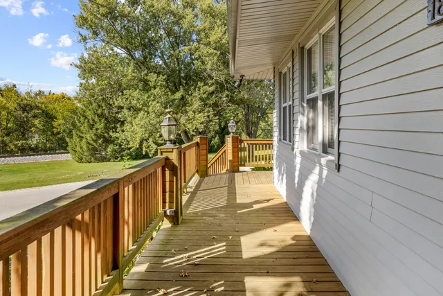 a view of a balcony with wooden floor