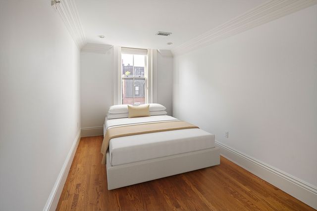 a room with a bed and a window