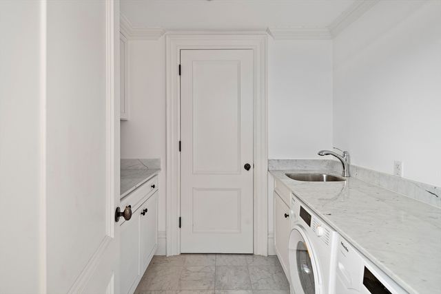 a view of a bathroom with a sink and dishwasher