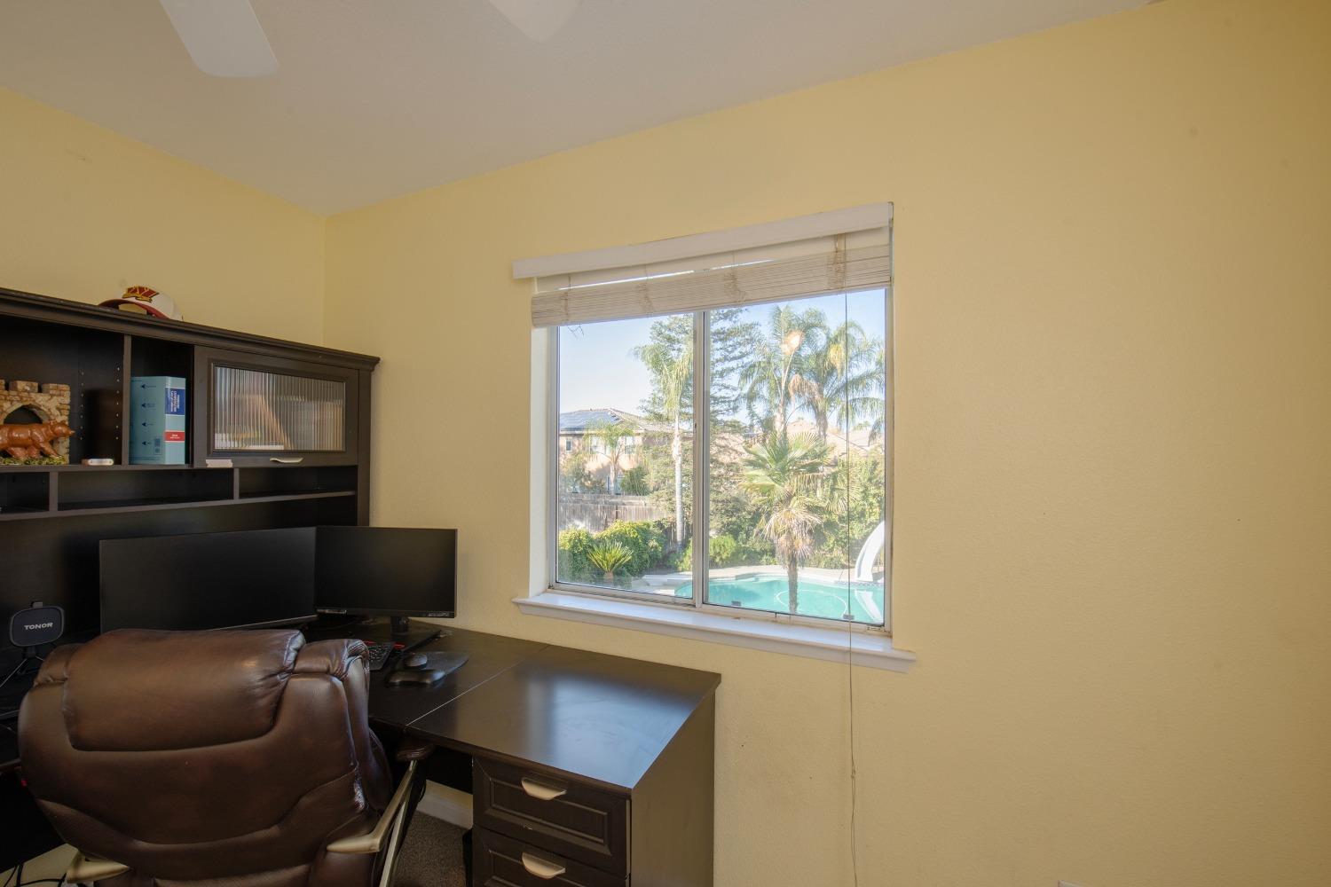 1847 Goshen Avenue Clovis, CA 93611 - Photo 15 of 39 a living room with furniture and a floor to ceiling window