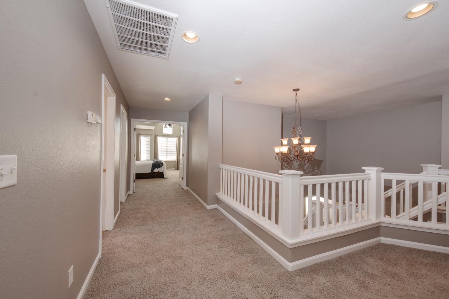 1847 Goshen Avenue Clovis, CA 93611 - Photo 18 of 39 a view of a hallway with windows and stairs