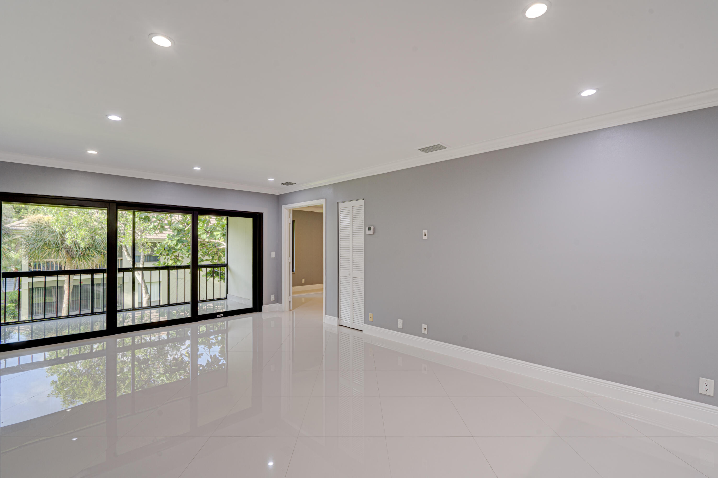 159 Northwest 70th Street, Unit 516 Boca Raton, FL 33487 - Photo 22 of 39 a view of an empty room with a window
