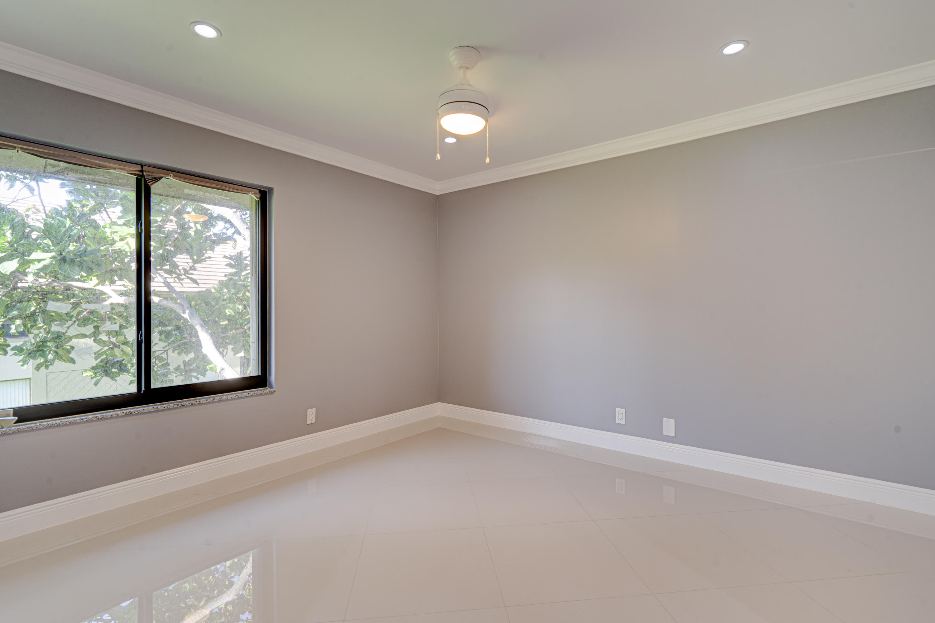 159 Northwest 70th Street, Unit 516 Boca Raton, FL 33487 - Photo 28 of 39 an empty room with a window