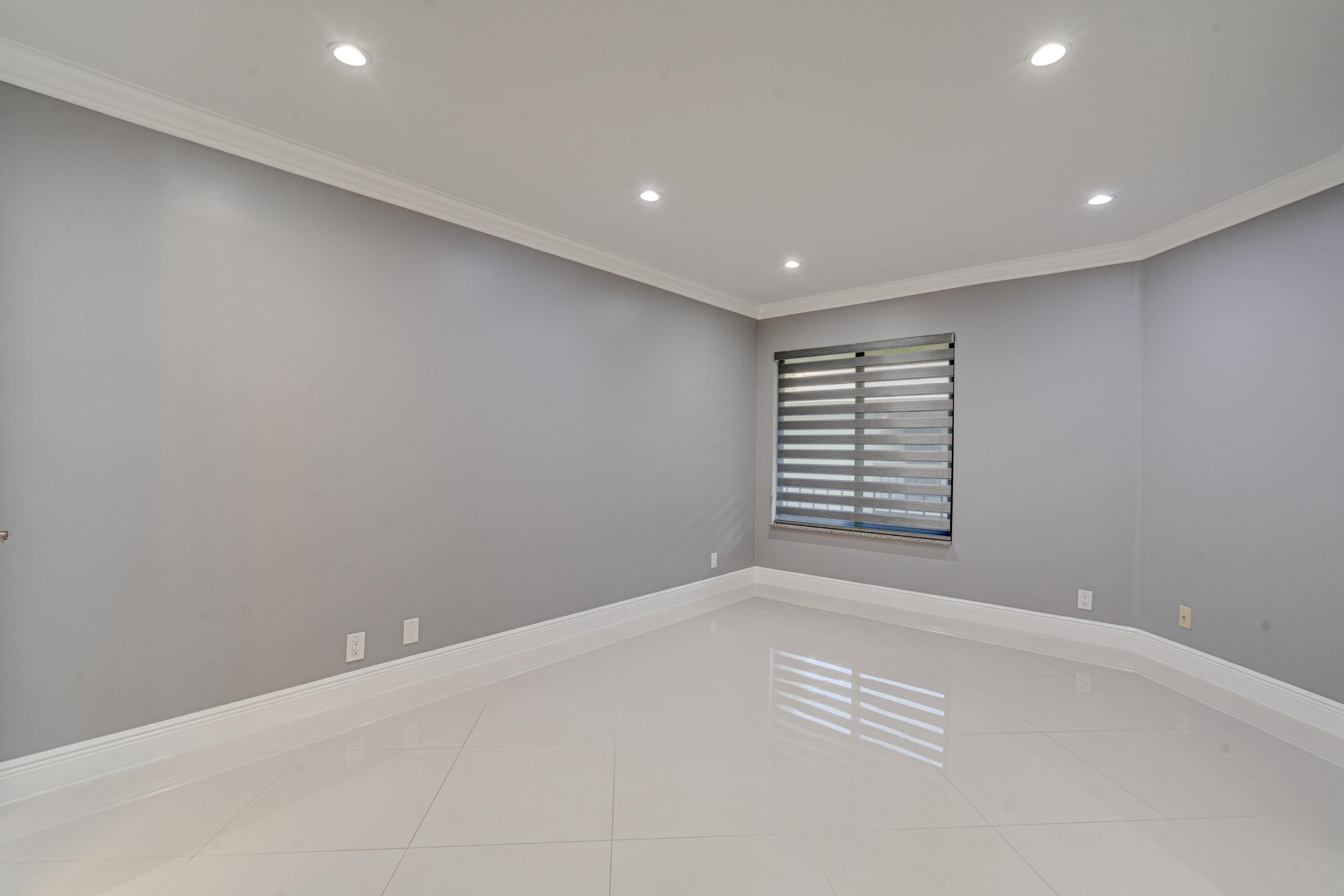 159 Northwest 70th Street, Unit 516 Boca Raton, FL 33487 - Photo 34 of 39 a view of an empty room with a window