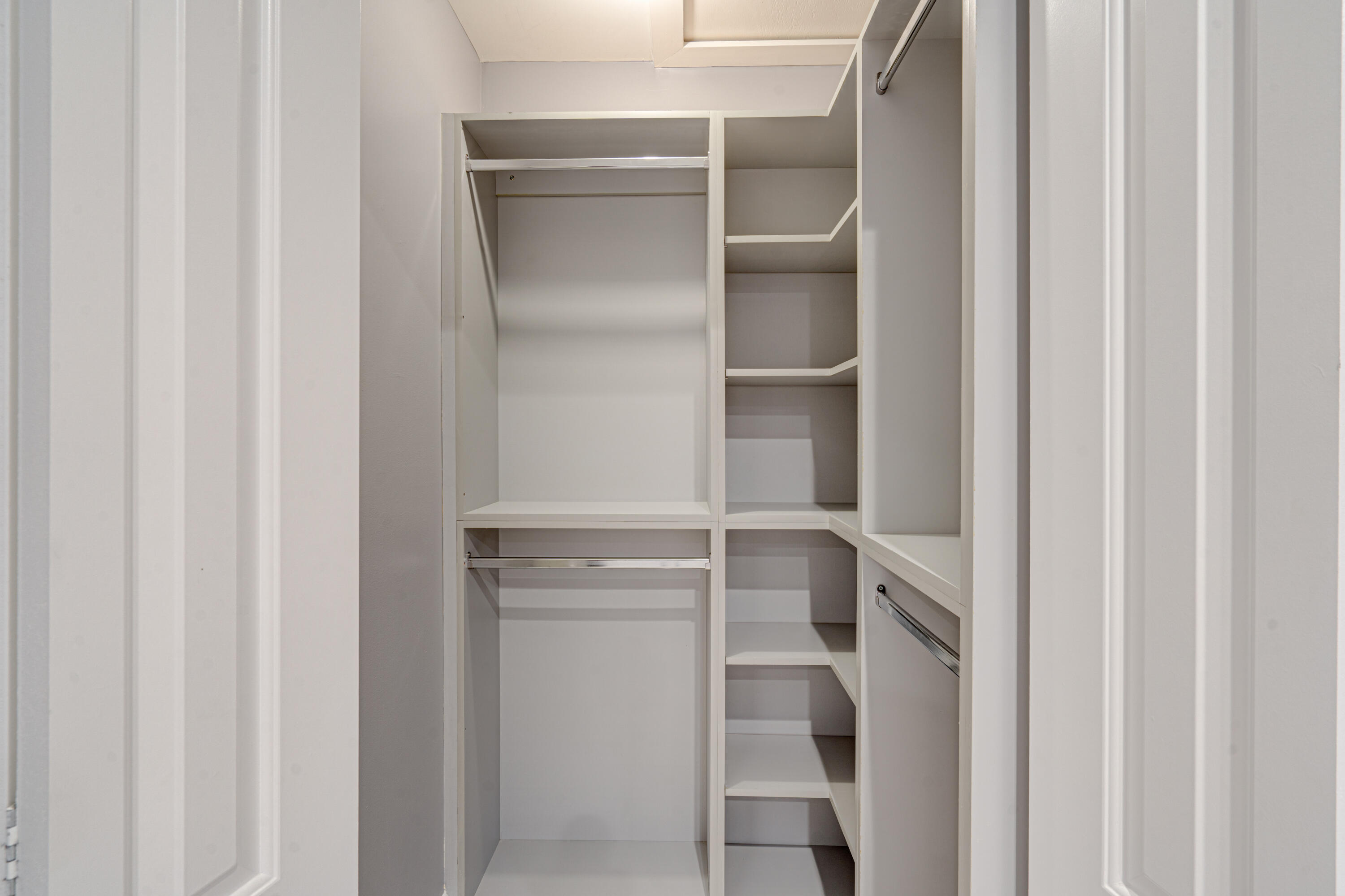 159 Northwest 70th Street, Unit 516 Boca Raton, FL 33487 - Photo 36 of 39 a view of walk in closet with empty racks