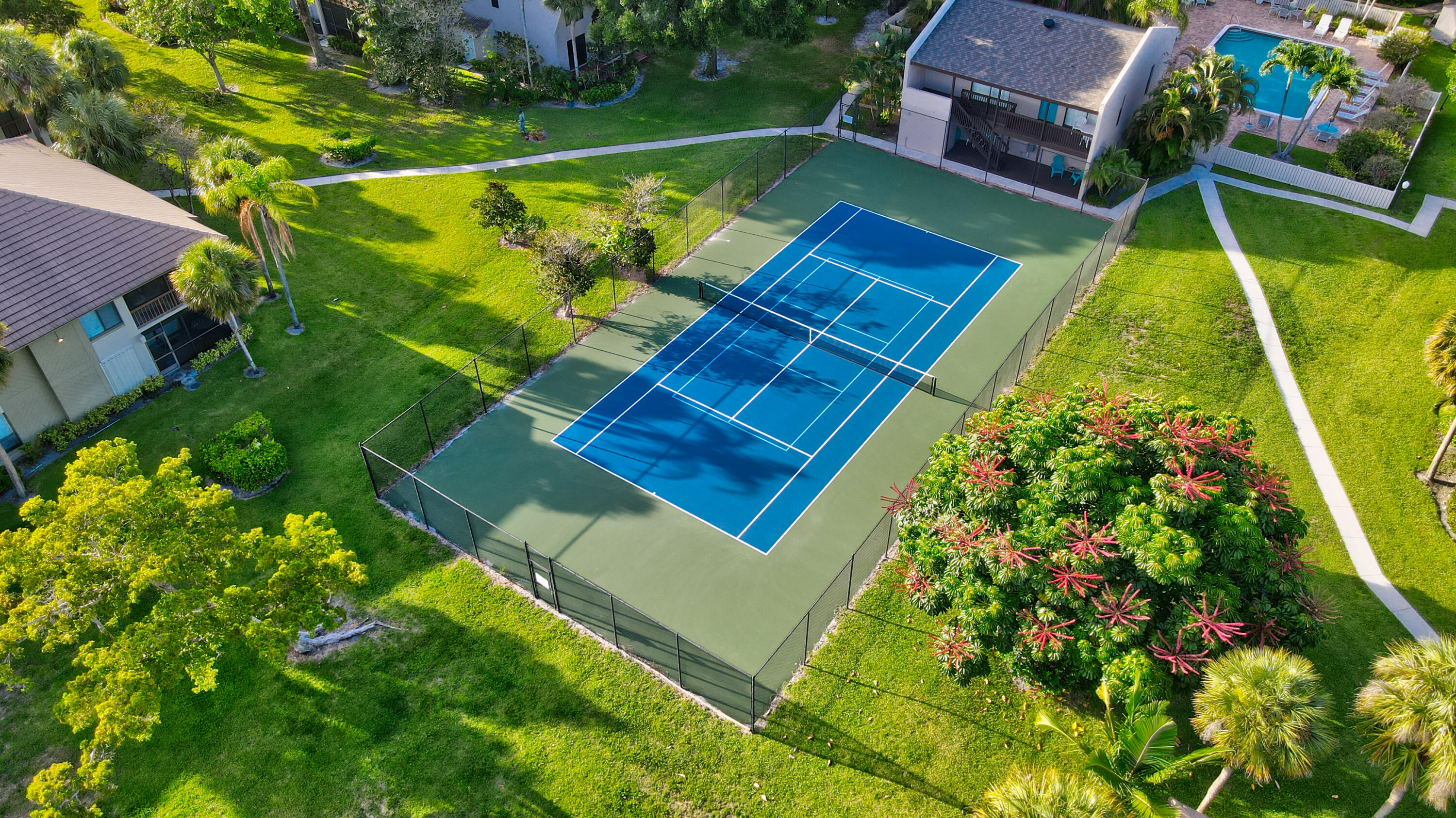 159 Northwest 70th Street, Unit 516 Boca Raton, FL 33487 - Photo 8 of 39 an aerial view of a pool