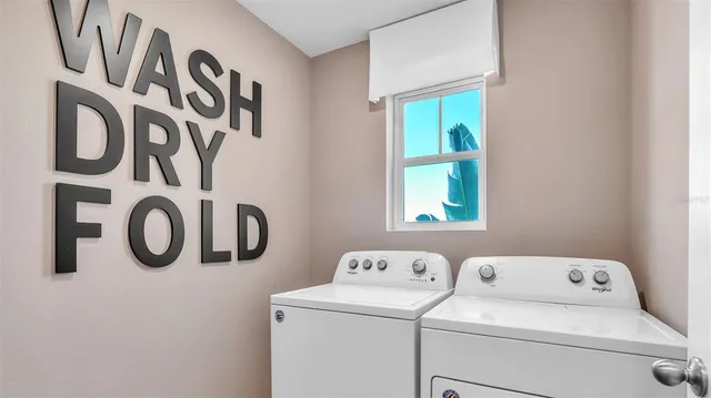 a utility room with dryer and washer