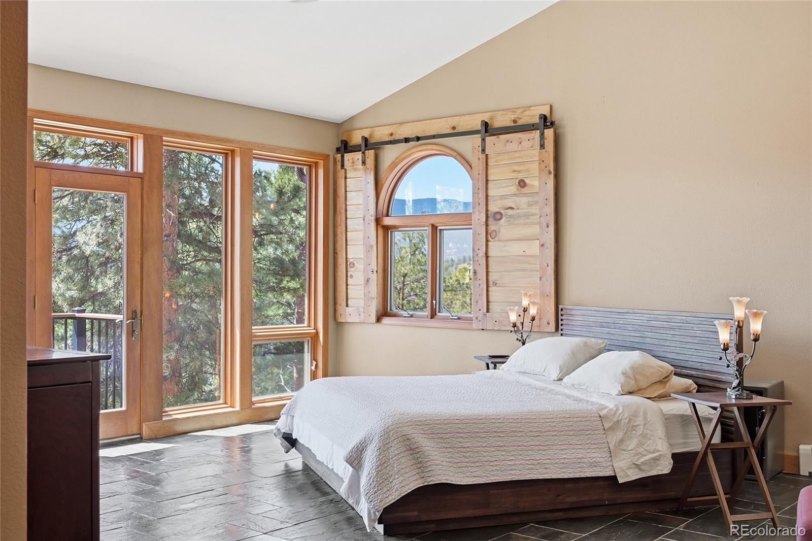 16 Auk Lane Bailey, CO 80421 - Photo 12 of 39 a bedroom with a bed and a large window
