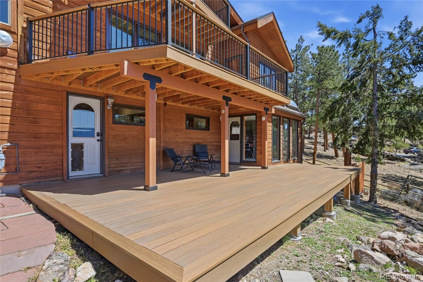 16 Auk Lane Bailey, CO 80421 - Photo 24 of 39 a view of a white building with a large tree