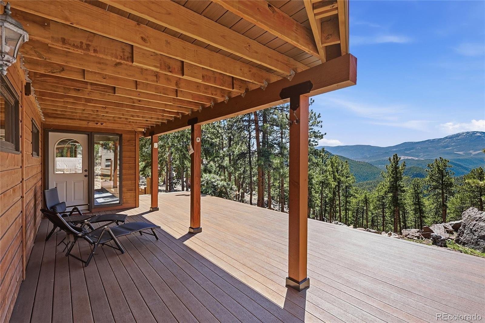 16 Auk Lane Bailey, CO 80421 - Photo 25 of 39 a patio with water table and chairs