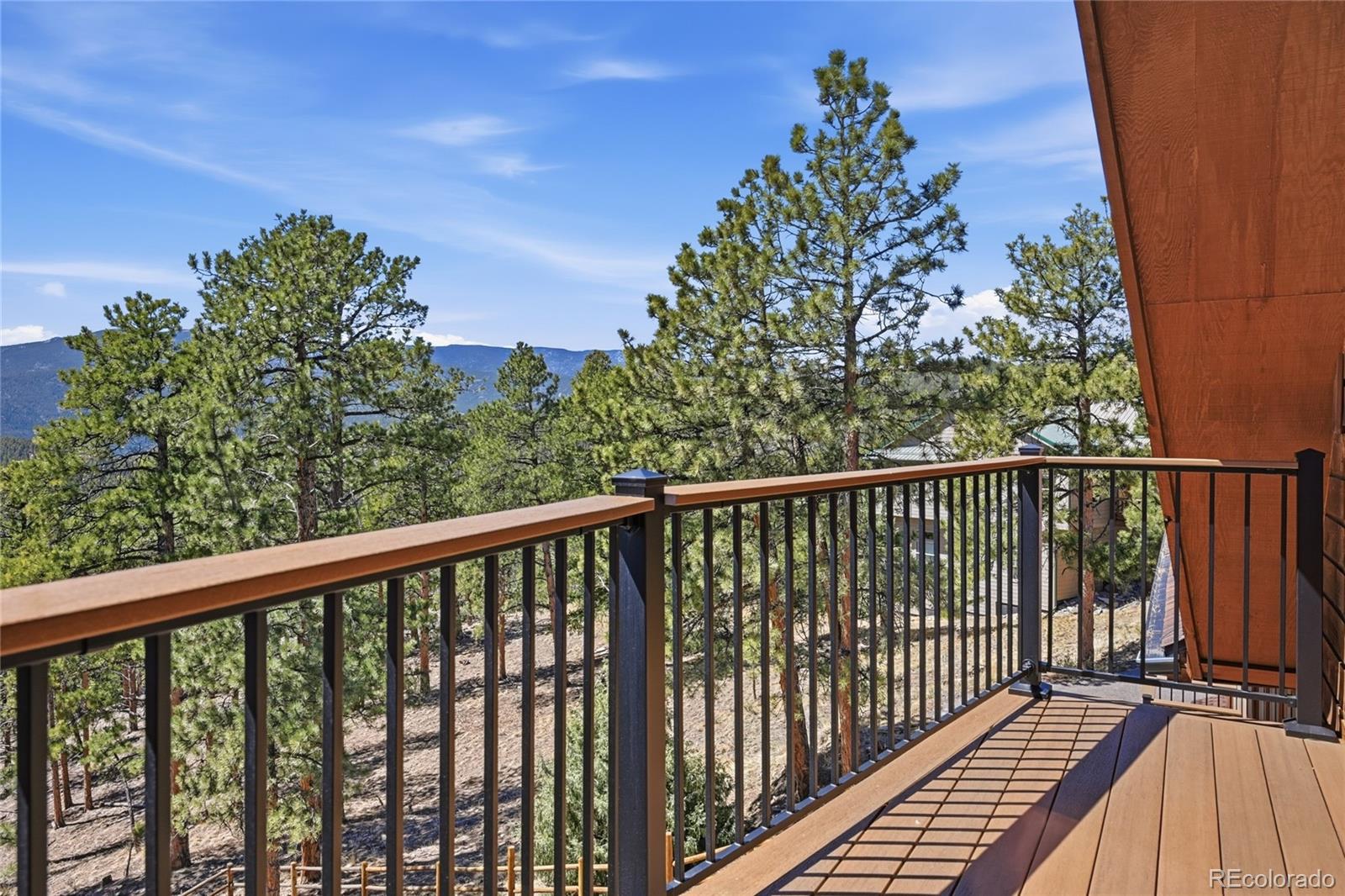 16 Auk Lane Bailey, CO 80421 - Photo 28 of 39 a view of a balcony with wooden fence