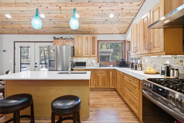 a bathroom with a sink double vanity and a mirror