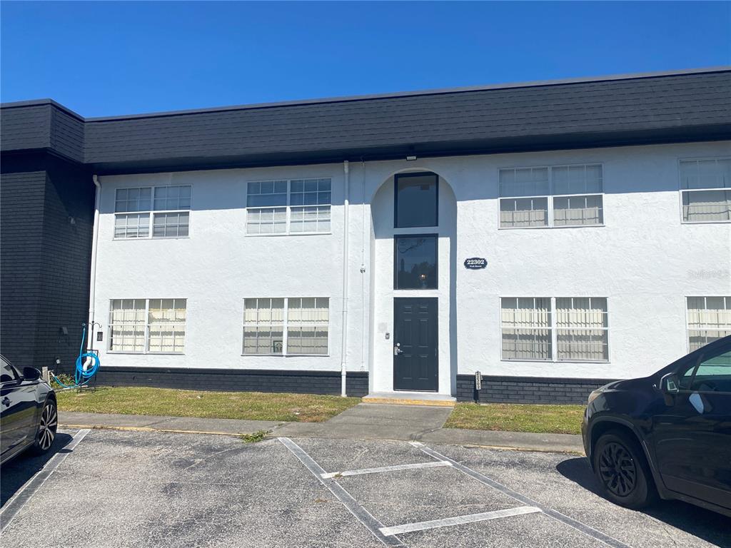 22302 Vick Street, Unit 112 Punta Gorda, FL 33980 - Photo 1 of 10 a view of front door with outdoor space