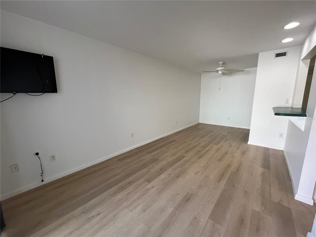 22302 Vick Street, Unit 112 Punta Gorda, FL 33980 - Photo 4 of 10 a view of empty room with wooden floor