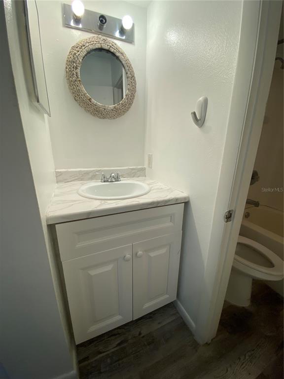 22302 Vick Street, Unit 112 Punta Gorda, FL 33980 - Photo 5 of 10 a utility room with a sink washer and dryer