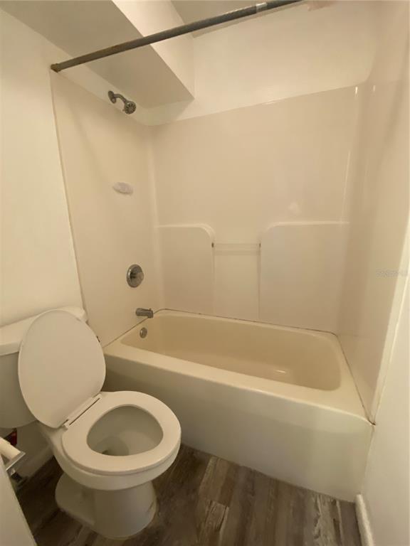 22302 Vick Street, Unit 112 Punta Gorda, FL 33980 - Photo 6 of 10 a bathroom with a toilet and a bathtub