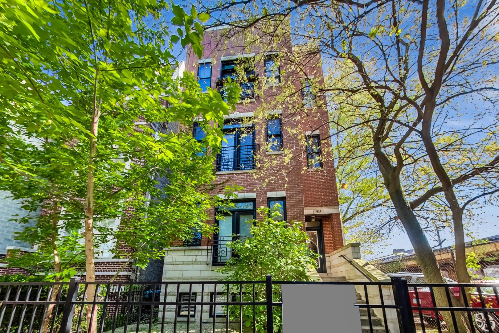 front view of a house with a tree