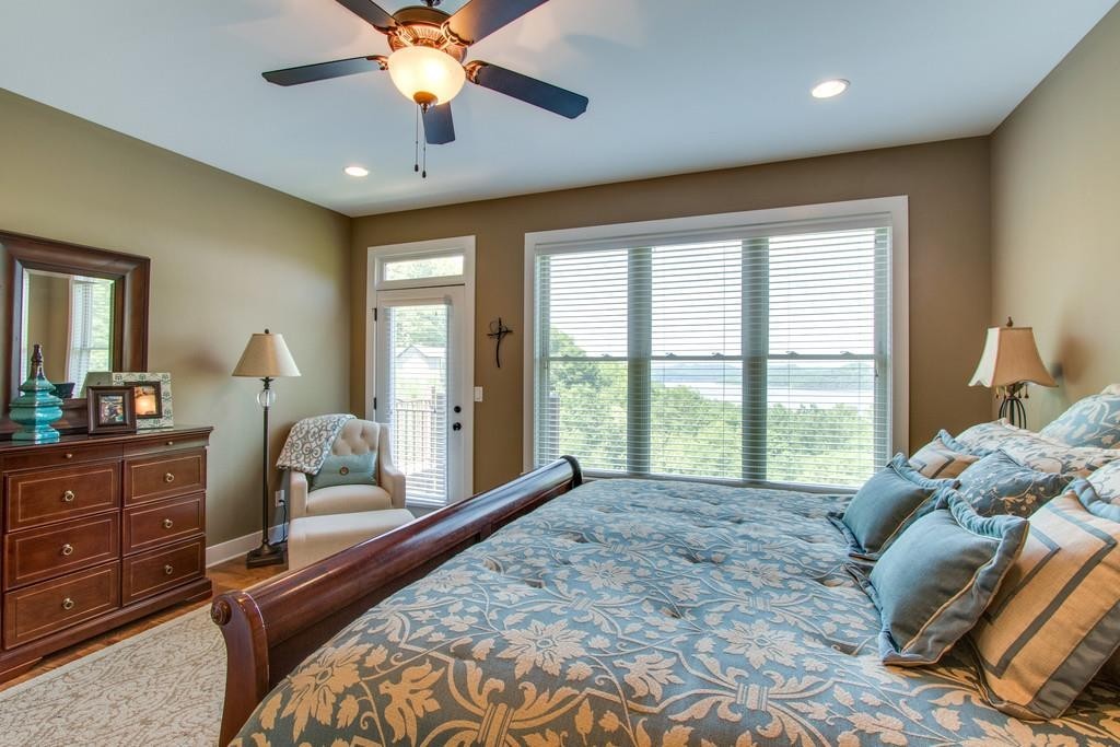 111 Vista Point Road, Unit 111 Silver Point, TN 38582 - Photo 17 of 30 a bed room with a bed and a chandelier