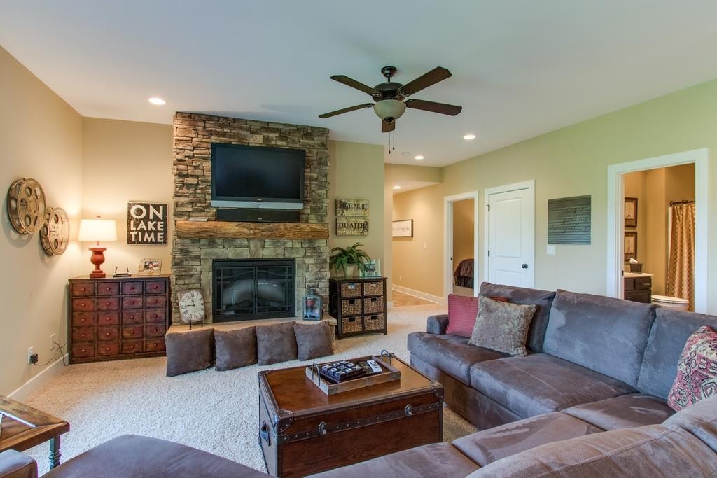 111 Vista Point Road, Unit 111 Silver Point, TN 38582 - Photo 21 of 30 a living room with furniture a flat screen tv and a fireplace