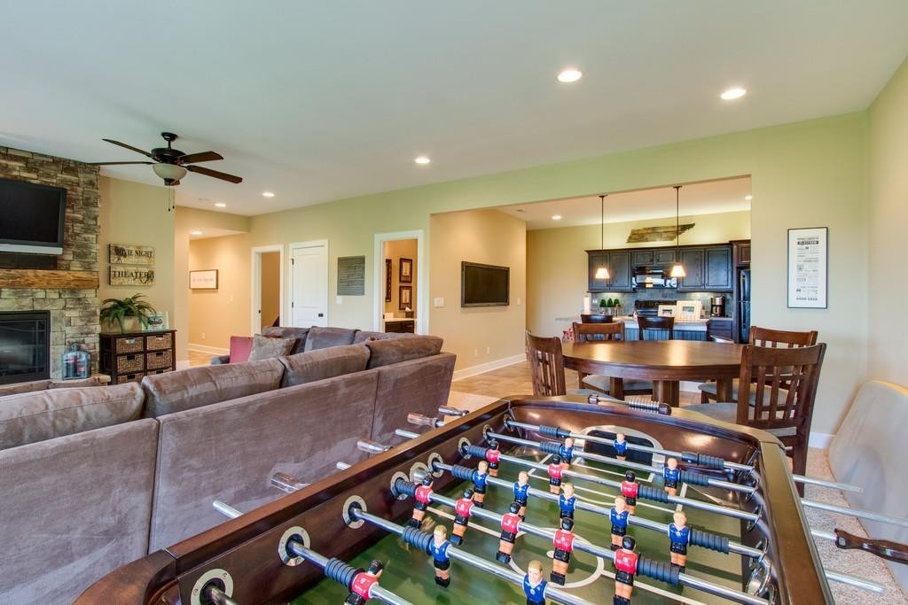111 Vista Point Road, Unit 111 Silver Point, TN 38582 - Photo 22 of 30 a living room with furniture and a flat screen tv