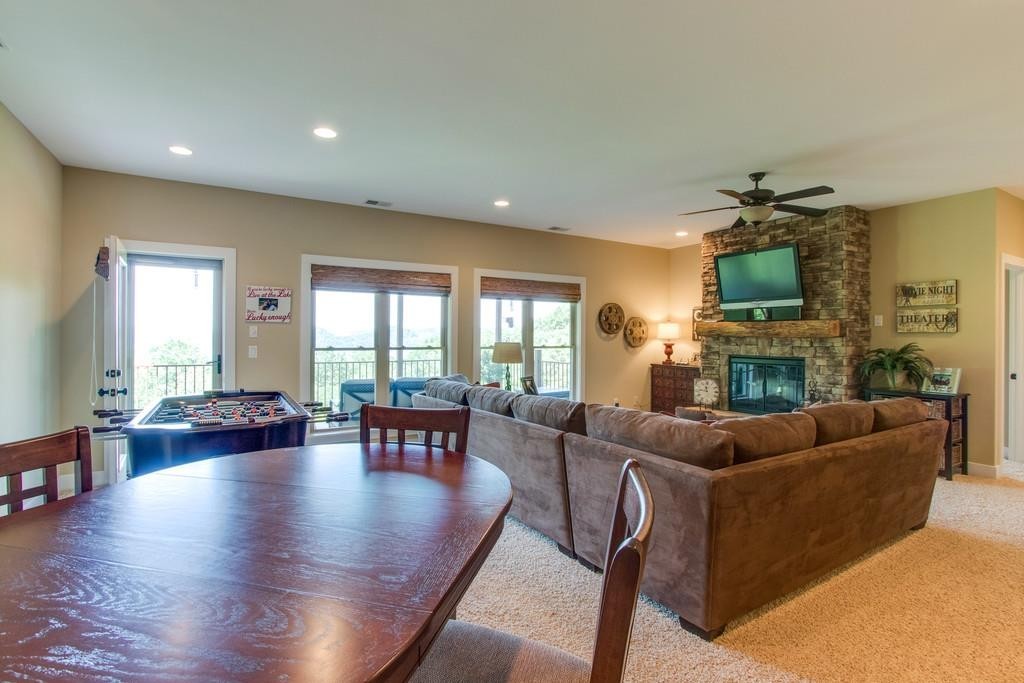 111 Vista Point Road, Unit 111 Silver Point, TN 38582 - Photo 23 of 30 a living room with fireplace furniture and a wooden floor