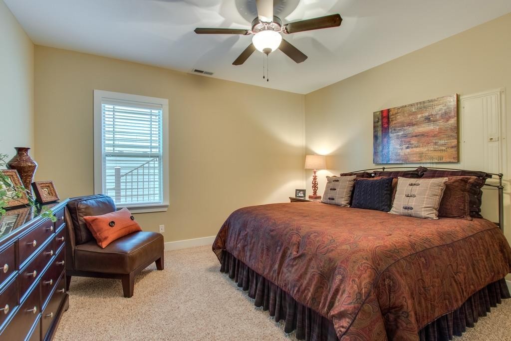 111 Vista Point Road, Unit 111 Silver Point, TN 38582 - Photo 24 of 30 a bed room with a bed and a chandelier