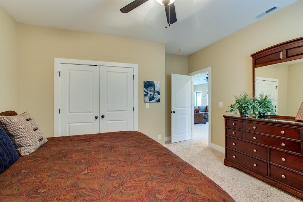 111 Vista Point Road, Unit 111 Silver Point, TN 38582 - Photo 25 of 30 a bedroom with a bed and a dresser