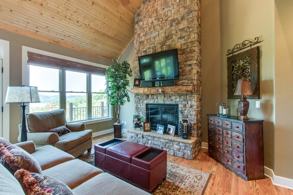 111 Vista Point Road, Unit 111 Silver Point, TN 38582 - Photo 7 of 30 a living room with furniture and a fireplace