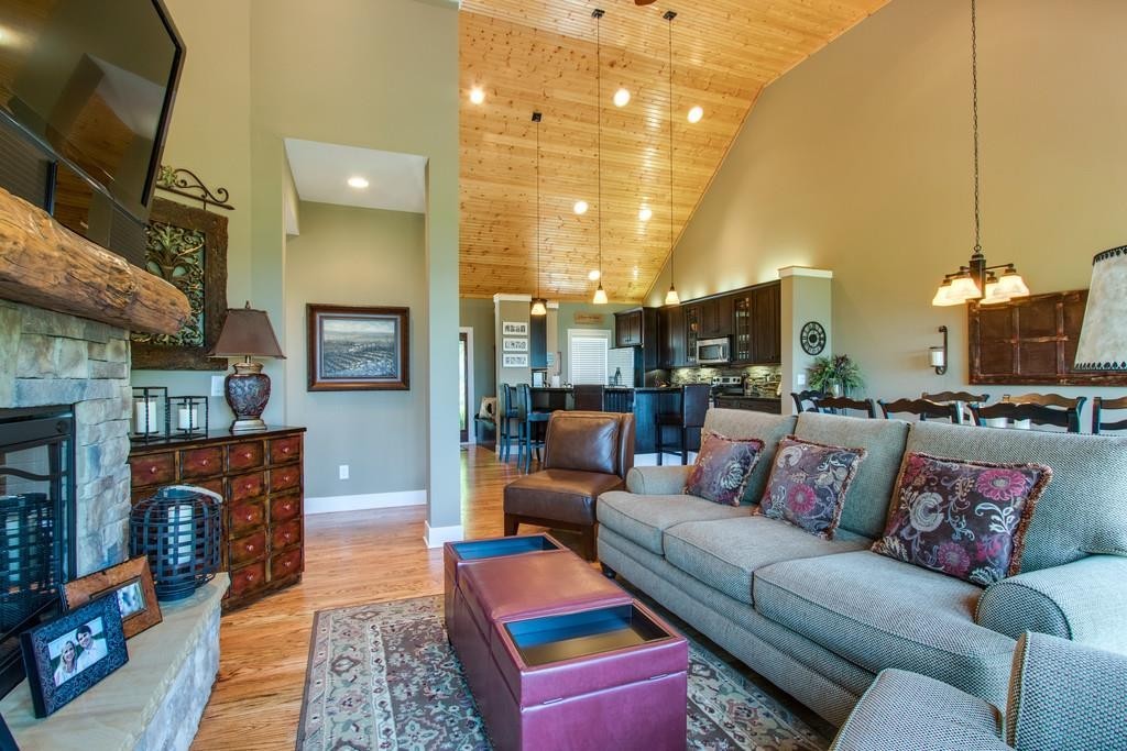 111 Vista Point Road, Unit 111 Silver Point, TN 38582 - Photo 9 of 30 a living room with furniture a fireplace and a chandelier
