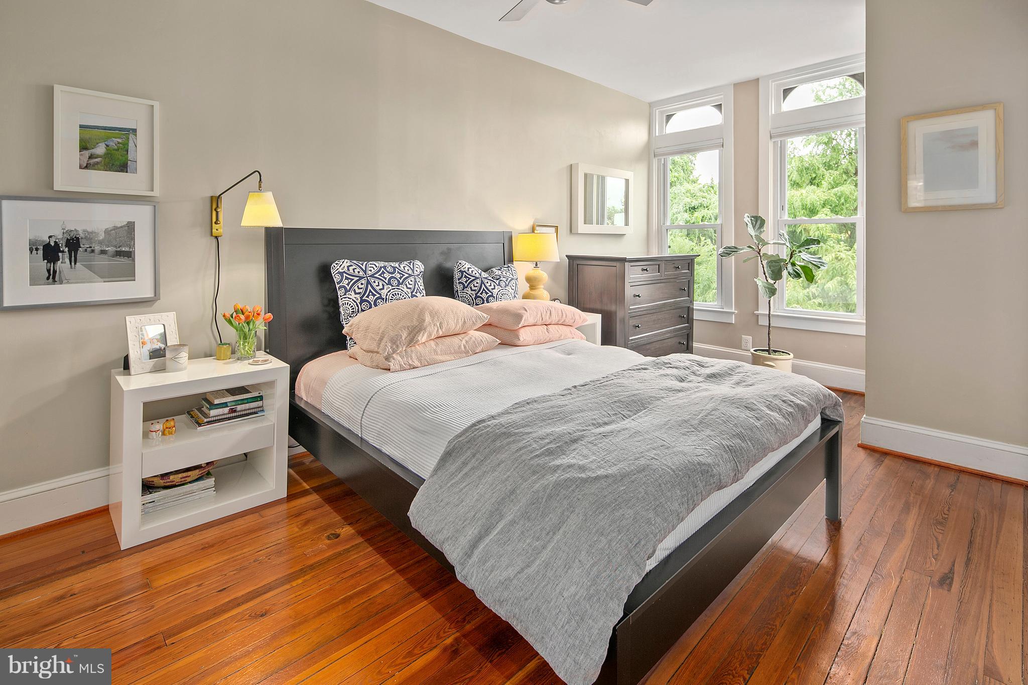 1437 G Street Northeast Washington, DC 20002 - Photo 15 of 24 a bedroom with a bed and wooden floor