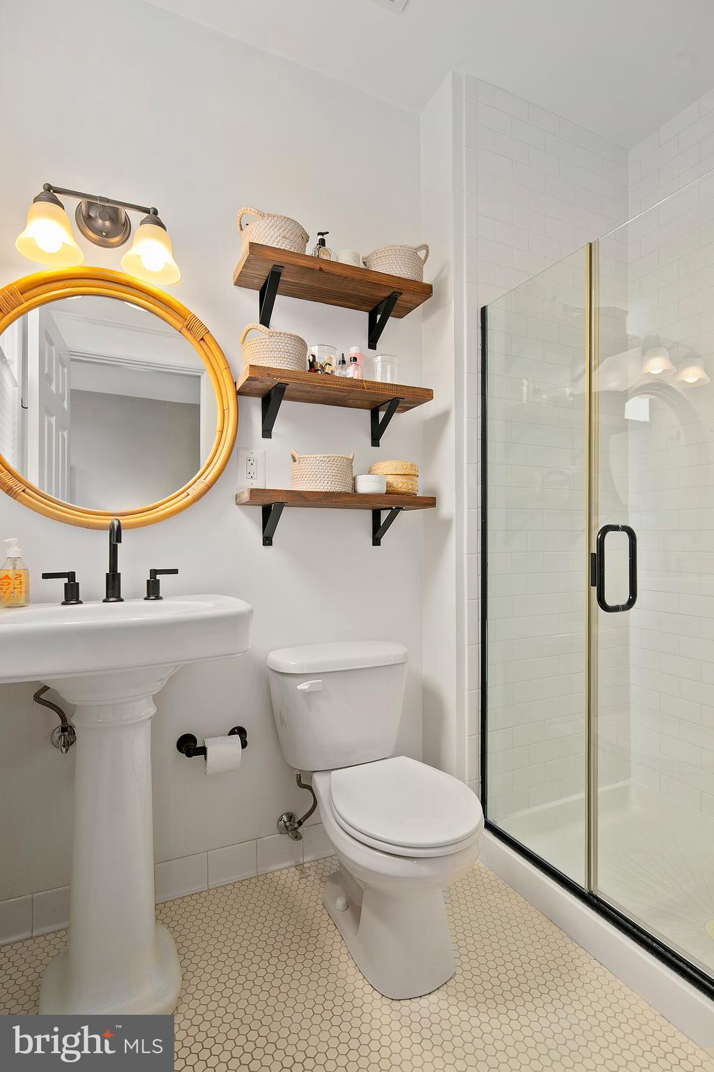 1437 G Street Northeast Washington, DC 20002 - Photo 17 of 24 a bathroom with a sink toilet and mirror