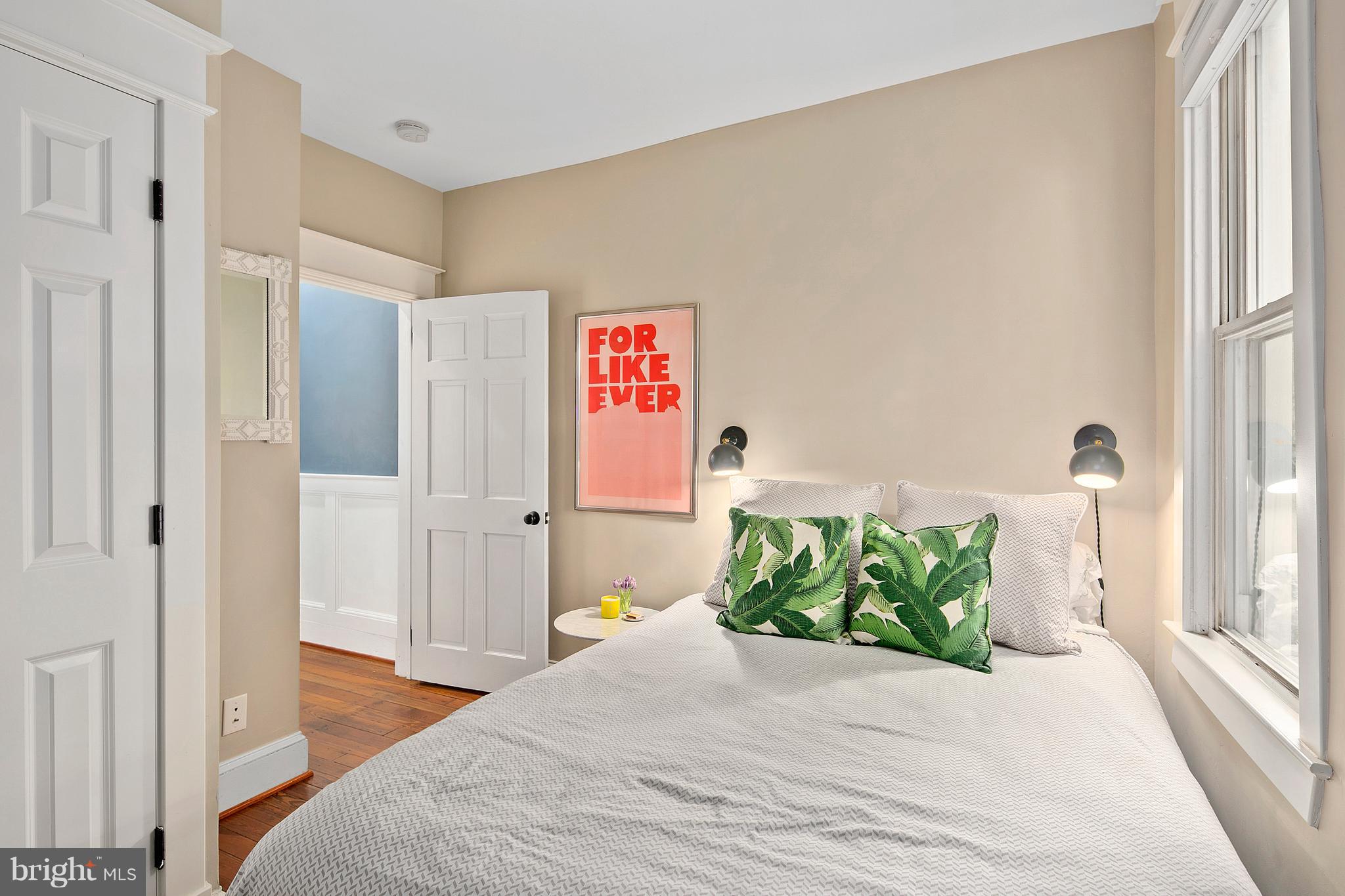 1437 G Street Northeast Washington, DC 20002 - Photo 19 of 24 a bedroom with a bed and a window