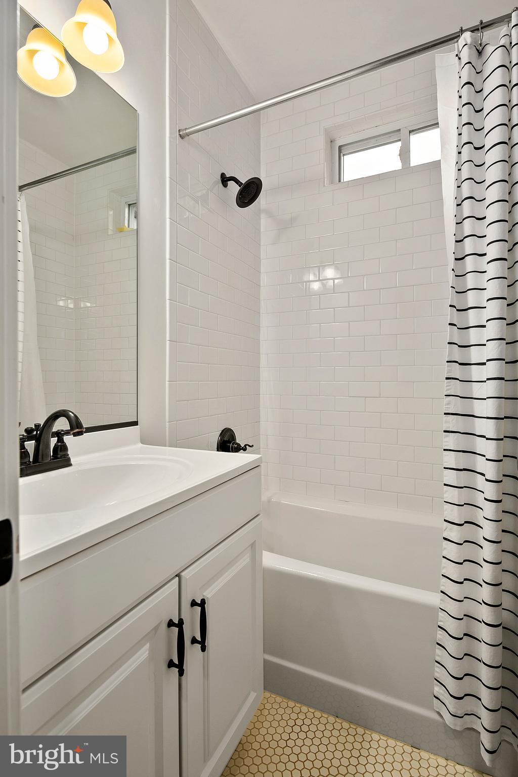 1437 G Street Northeast Washington, DC 20002 - Photo 20 of 24 a bathroom with a sink a toilet and shower