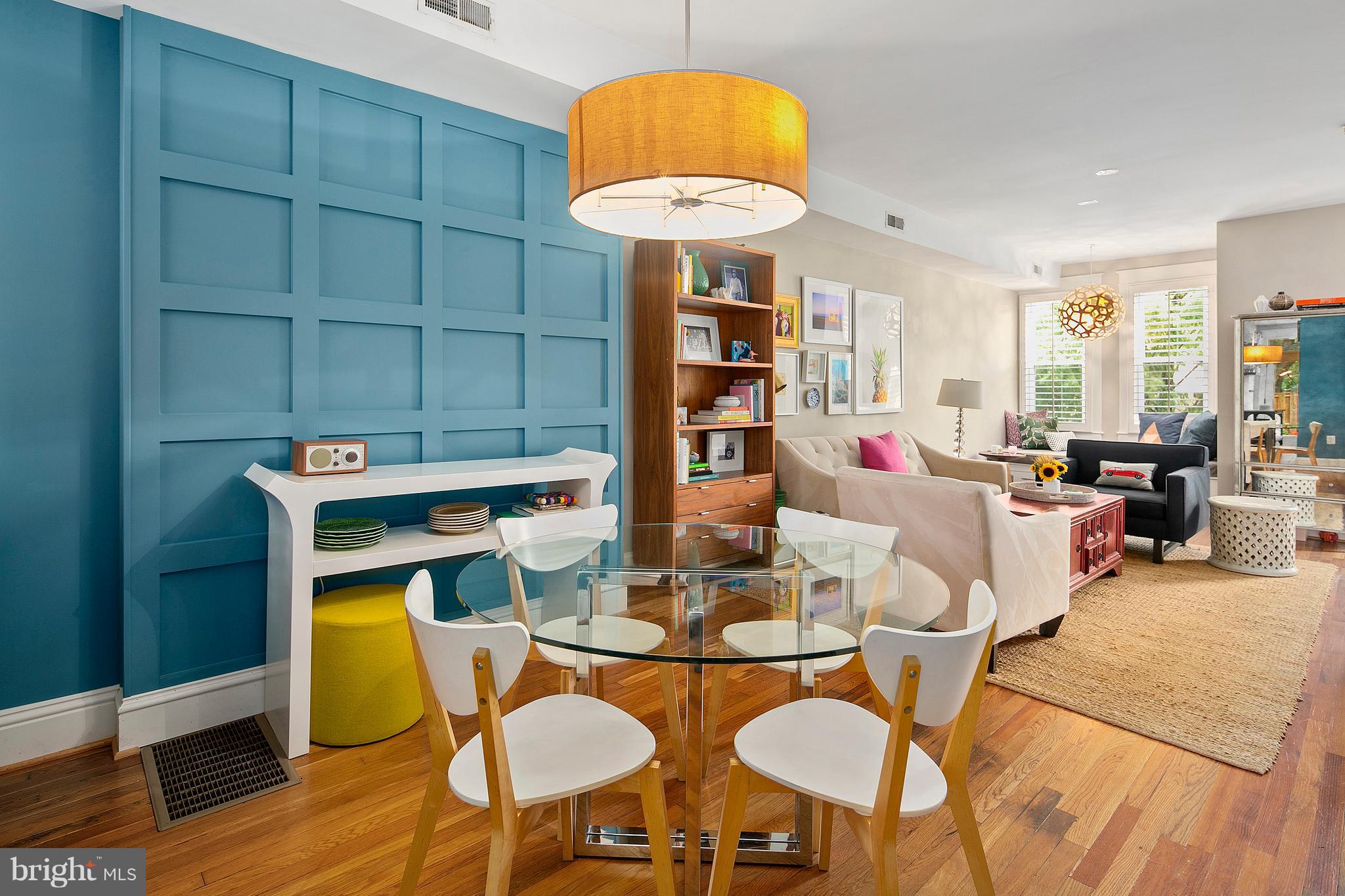 1437 G Street Northeast Washington, DC 20002 - Photo 3 of 24 a dining room with furniture and a chandelier