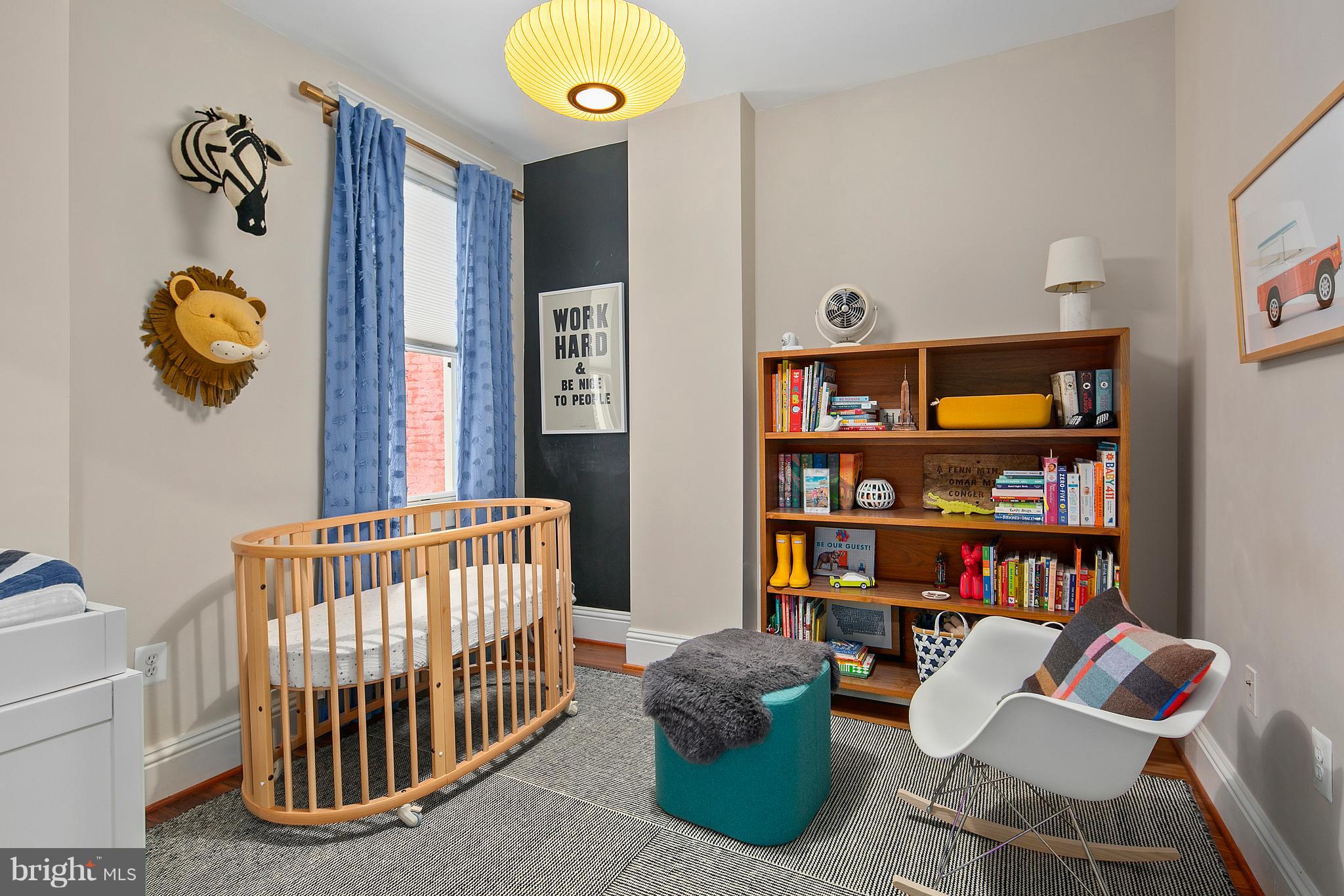 1437 G Street Northeast Washington, DC 20002 - Photo 21 of 24 a bedroom with furniture and a book shelf