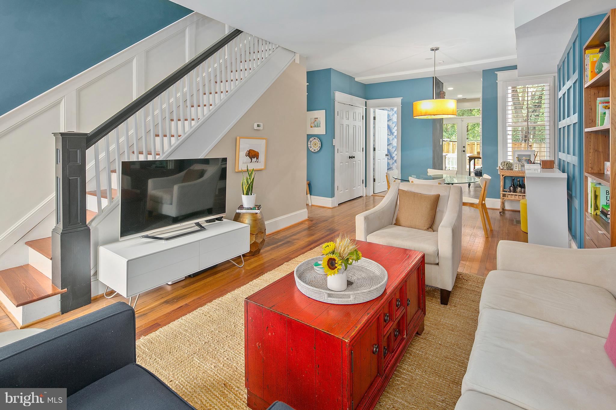 1437 G Street Northeast Washington, DC 20002 - Photo 6 of 24 a living room with furniture and a flat screen tv