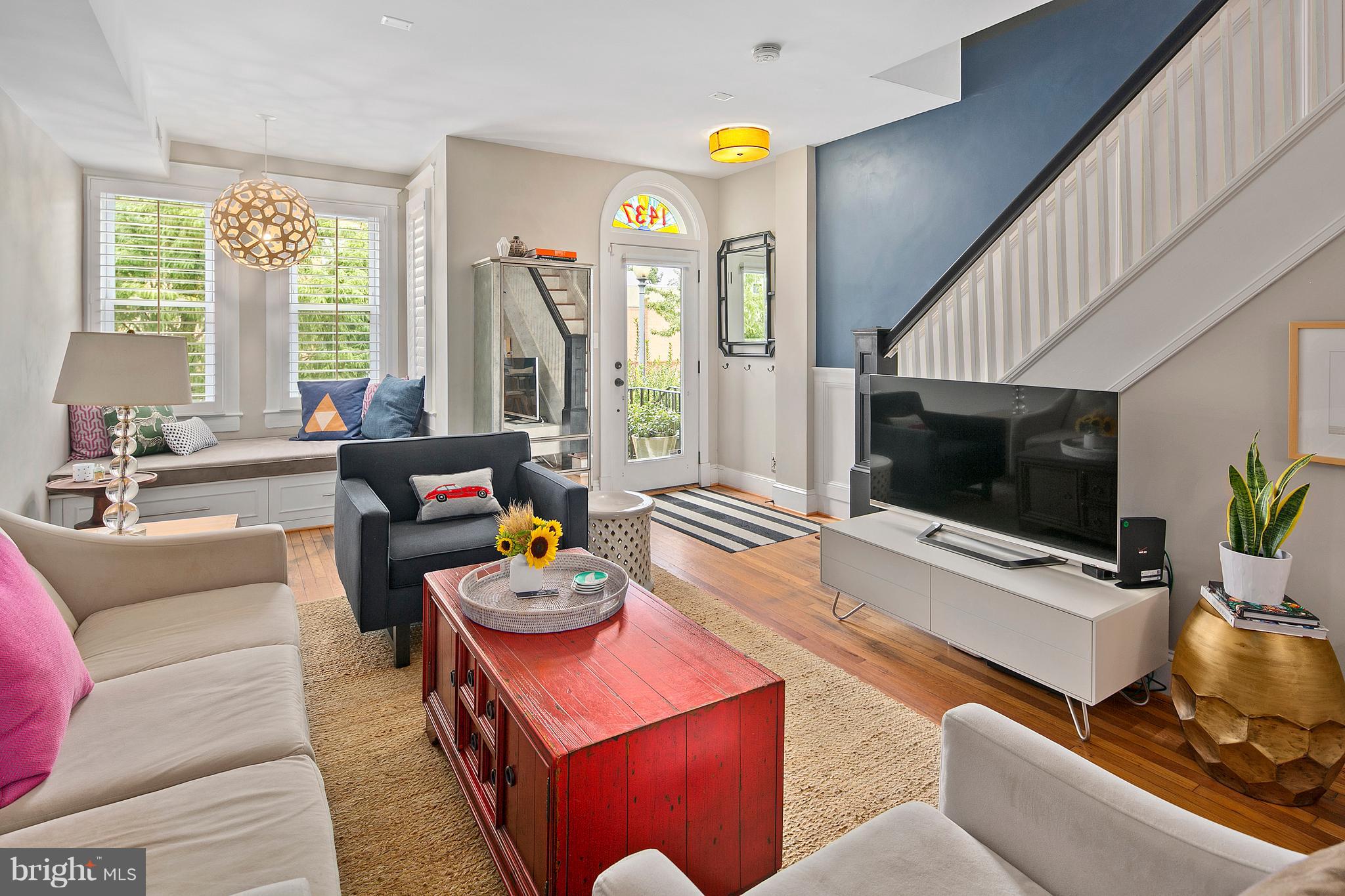 1437 G Street Northeast Washington, DC 20002 - Photo 7 of 24 a living room with furniture and a flat screen tv