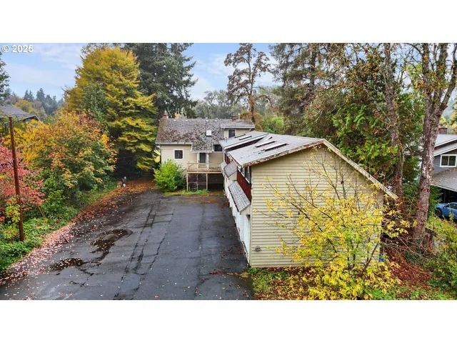 a balcony with a table and chairs