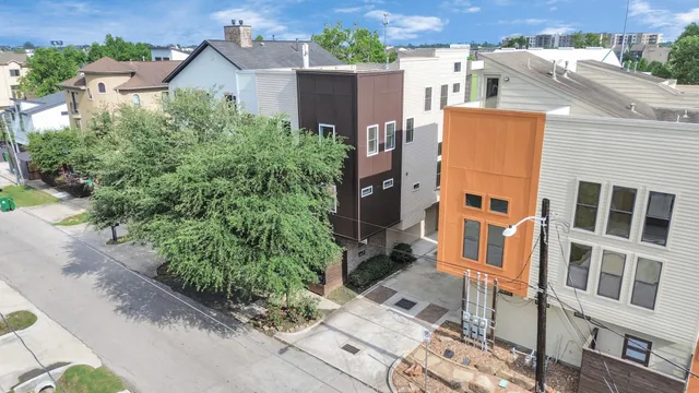 an aerial view of residential houses with plants