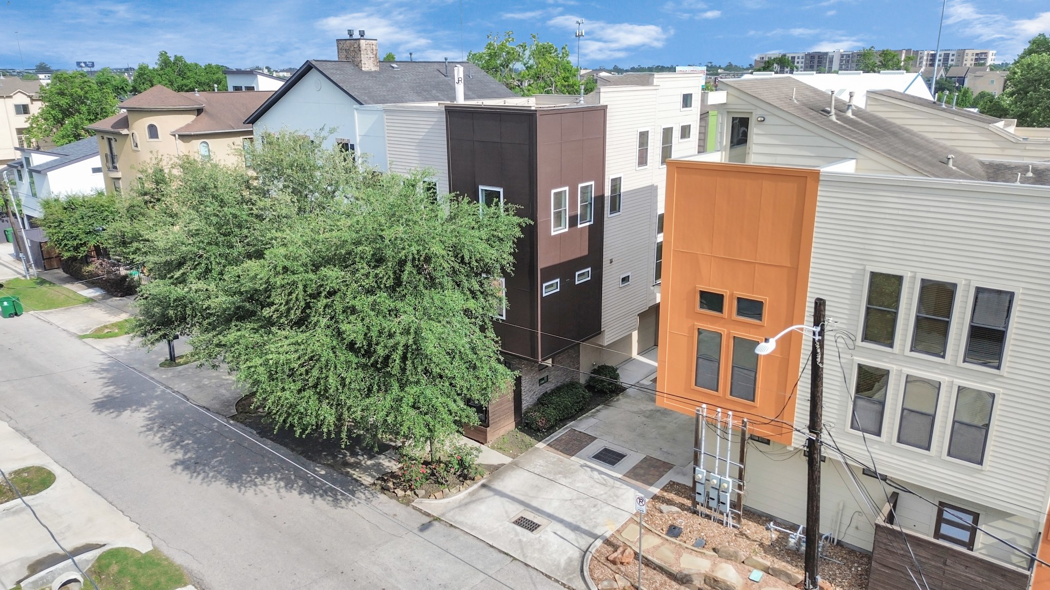 an aerial view of residential houses with plants
