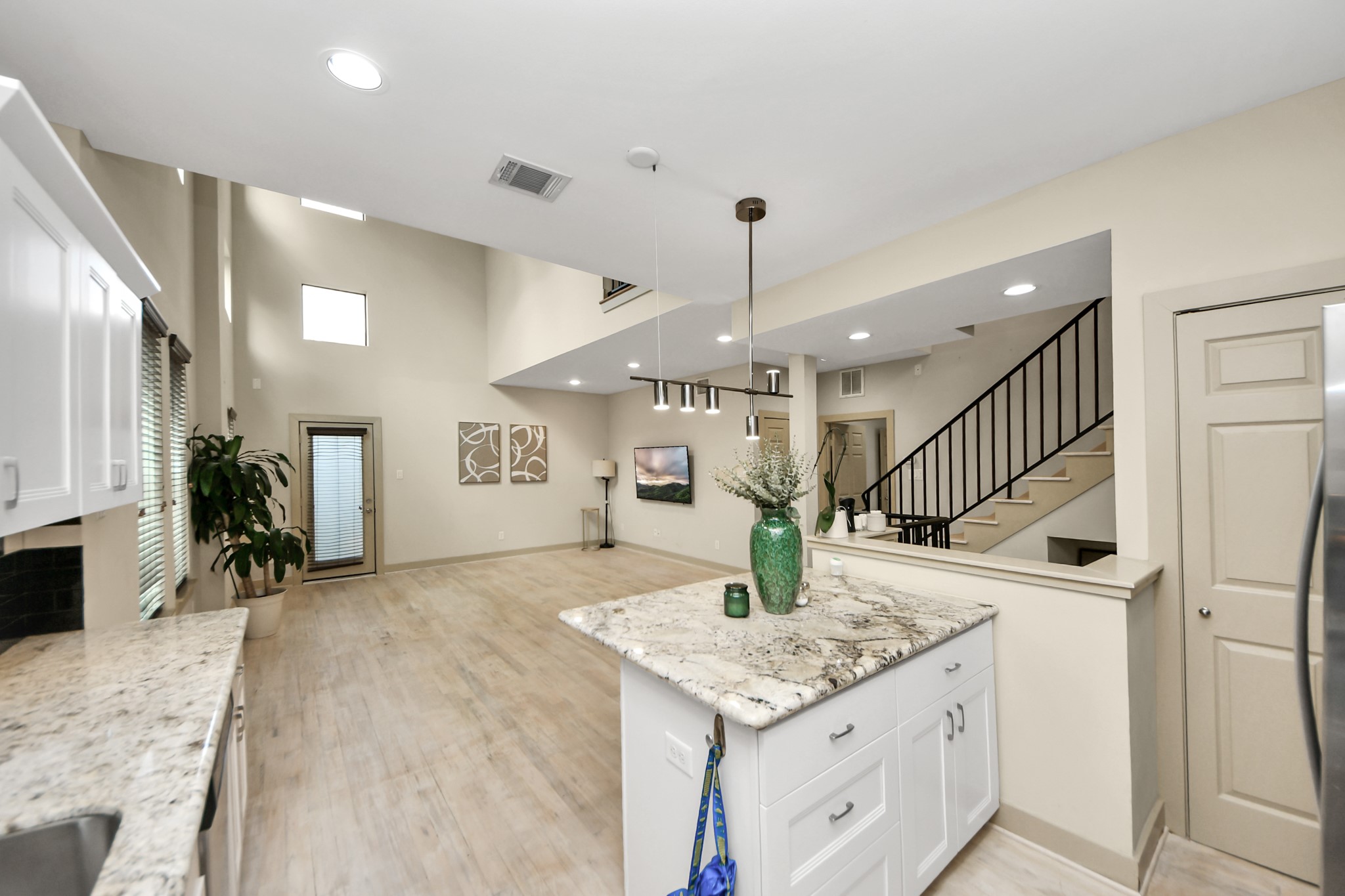 4510 Inker Street, Unit B Houston, TX 77007 - Photo 13 of 43 a kitchen with a sink a counter space and stainless steel appliances