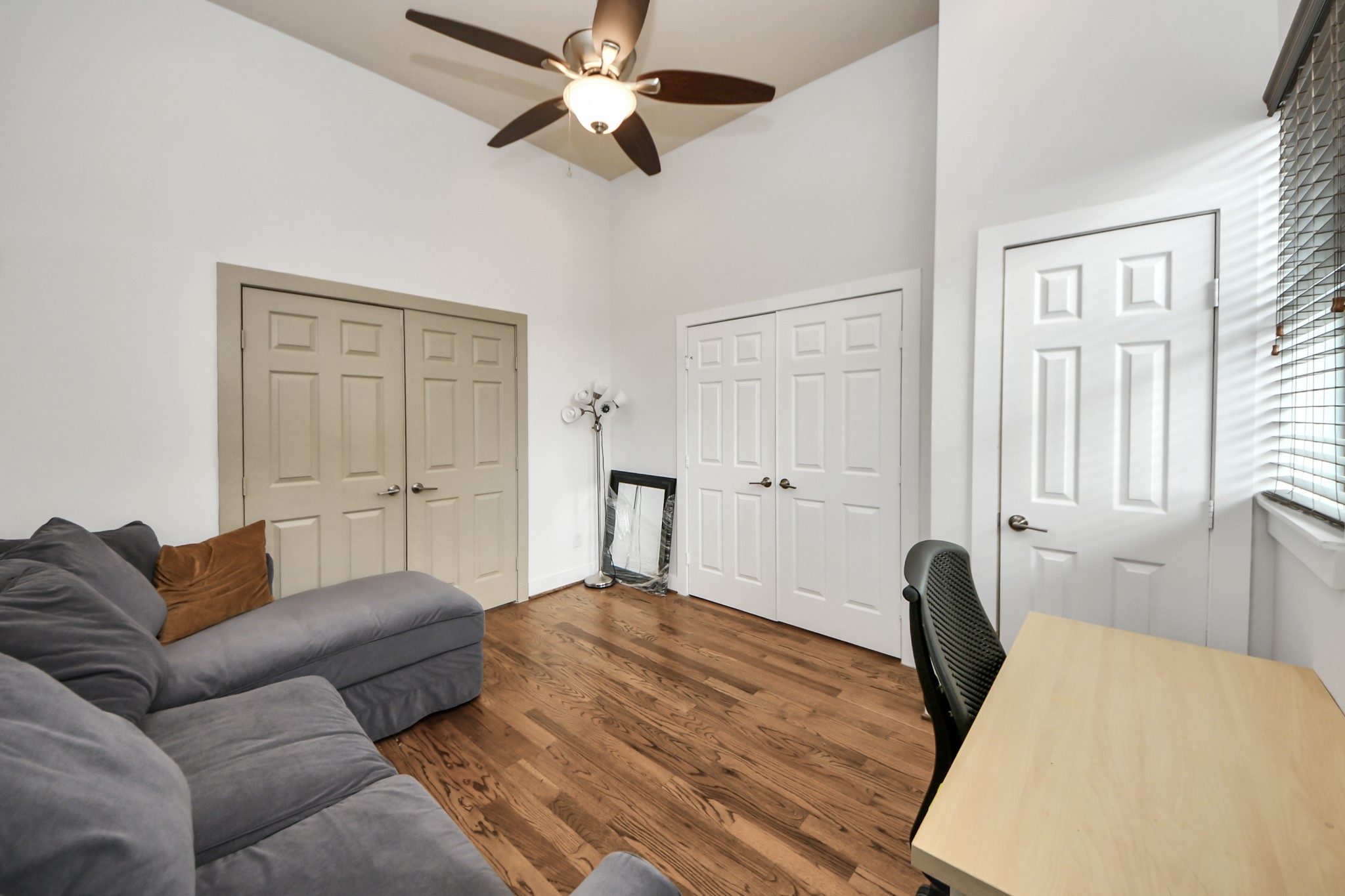 4510 Inker Street, Unit B Houston, TX 77007 - Photo 27 of 43 a bedroom with a bed furniture and wooden floor