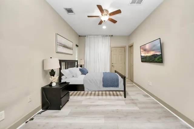 a bed room with furniture and a window