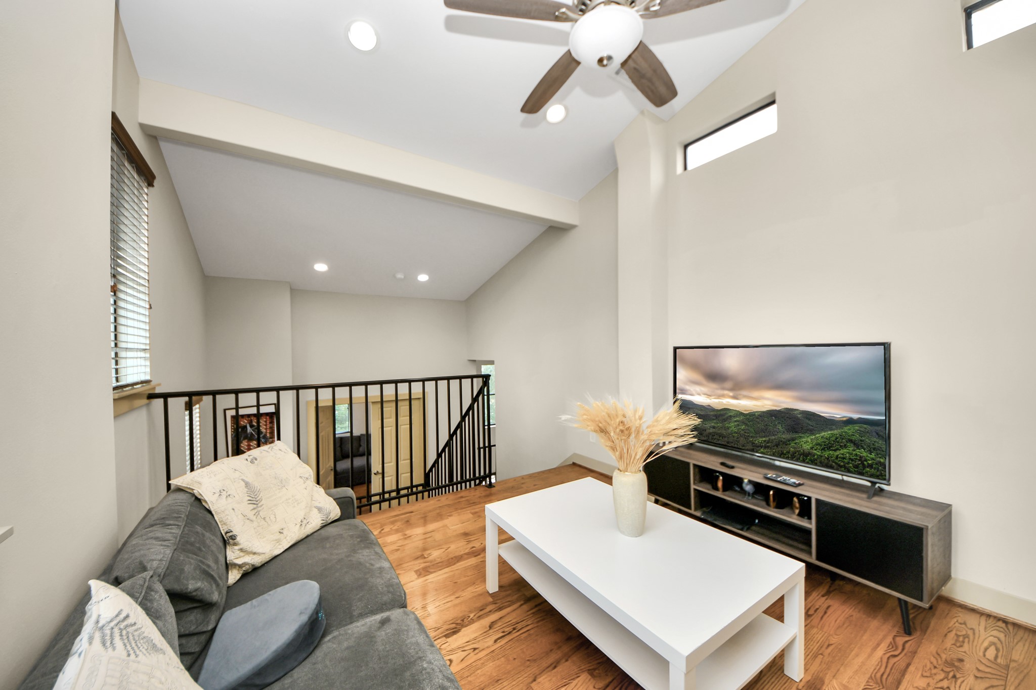4510 Inker Street, Unit B Houston, TX 77007 - Photo 31 of 43 a living room with furniture and a flat screen tv