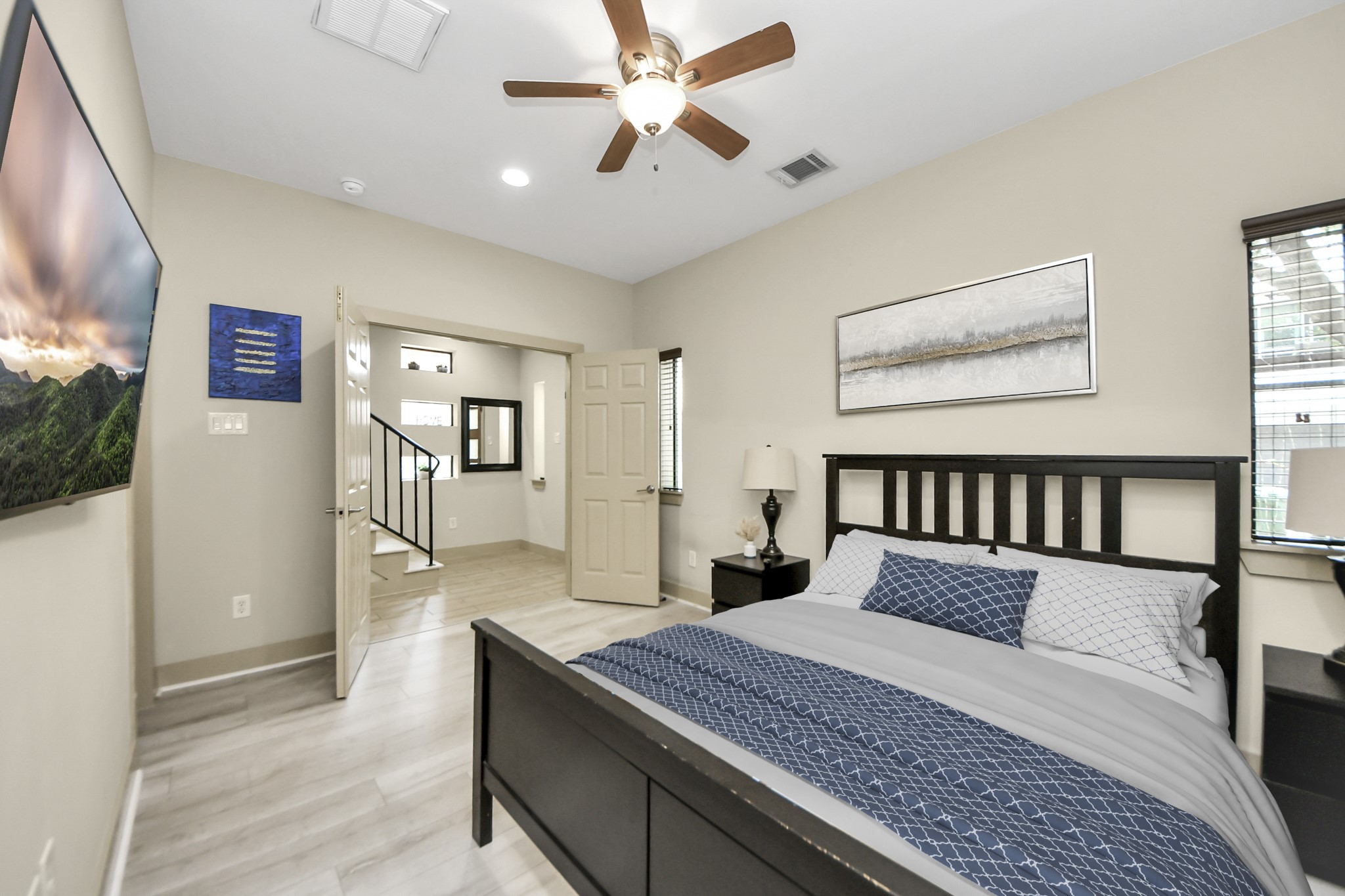 4510 Inker Street, Unit B Houston, TX 77007 - Photo 4 of 43 a bedroom with a large bed and a chandelier