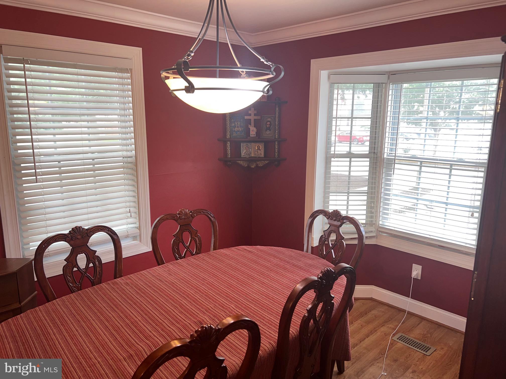 1761 Aberdeen Circle Crofton, MD 21114 - Photo 15 of 33 a bedroom with a bed and a table with windows
