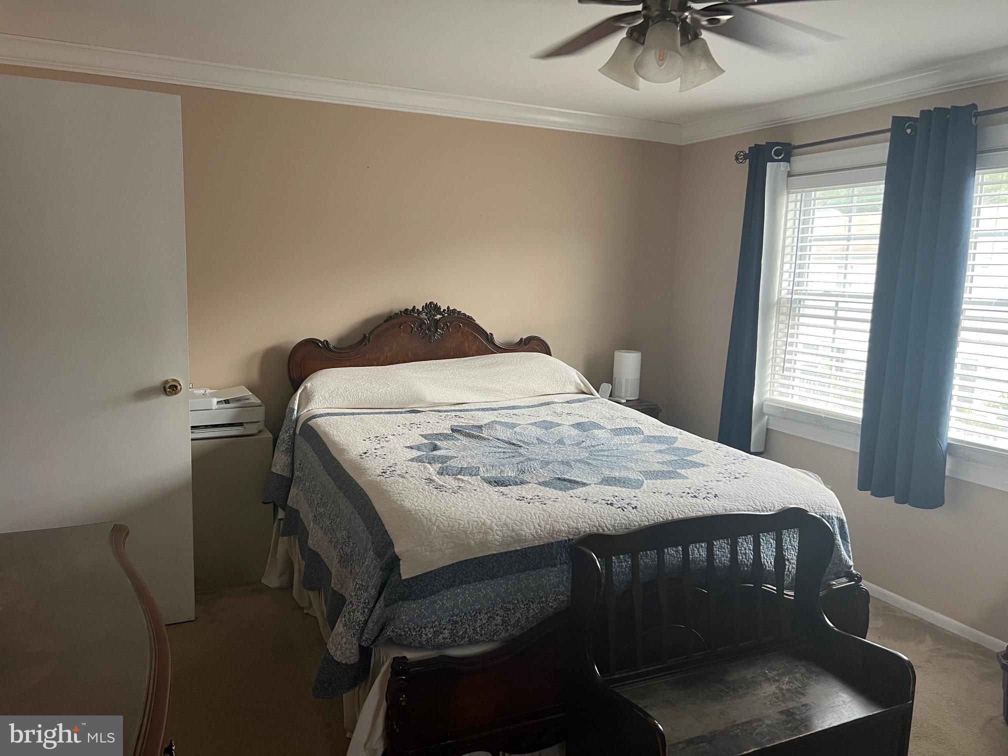 1761 Aberdeen Circle Crofton, MD 21114 - Photo 18 of 33 a bedroom with a bed and a chandelier