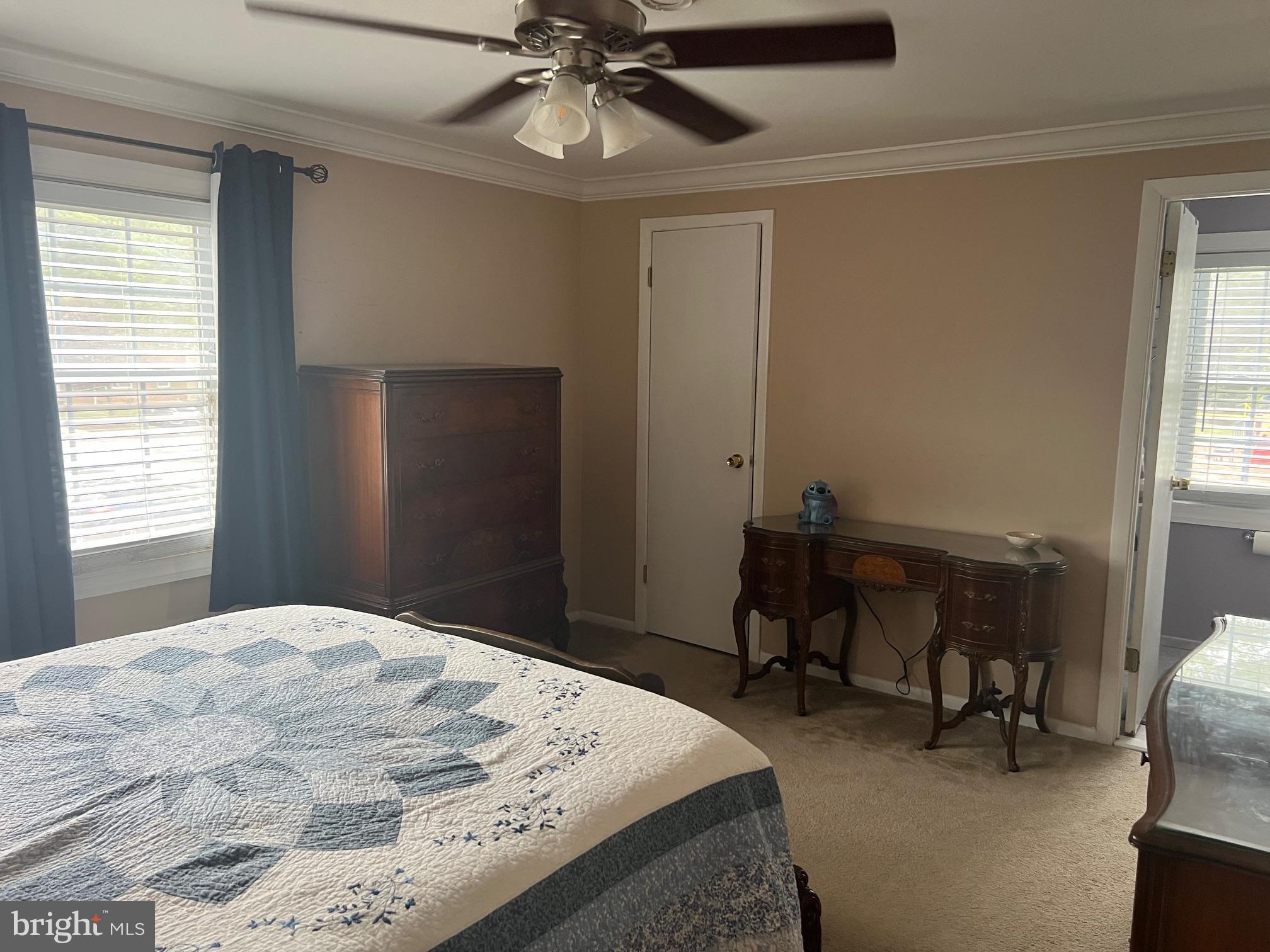 1761 Aberdeen Circle Crofton, MD 21114 - Photo 19 of 33 a bedroom with a bed and a chandelier