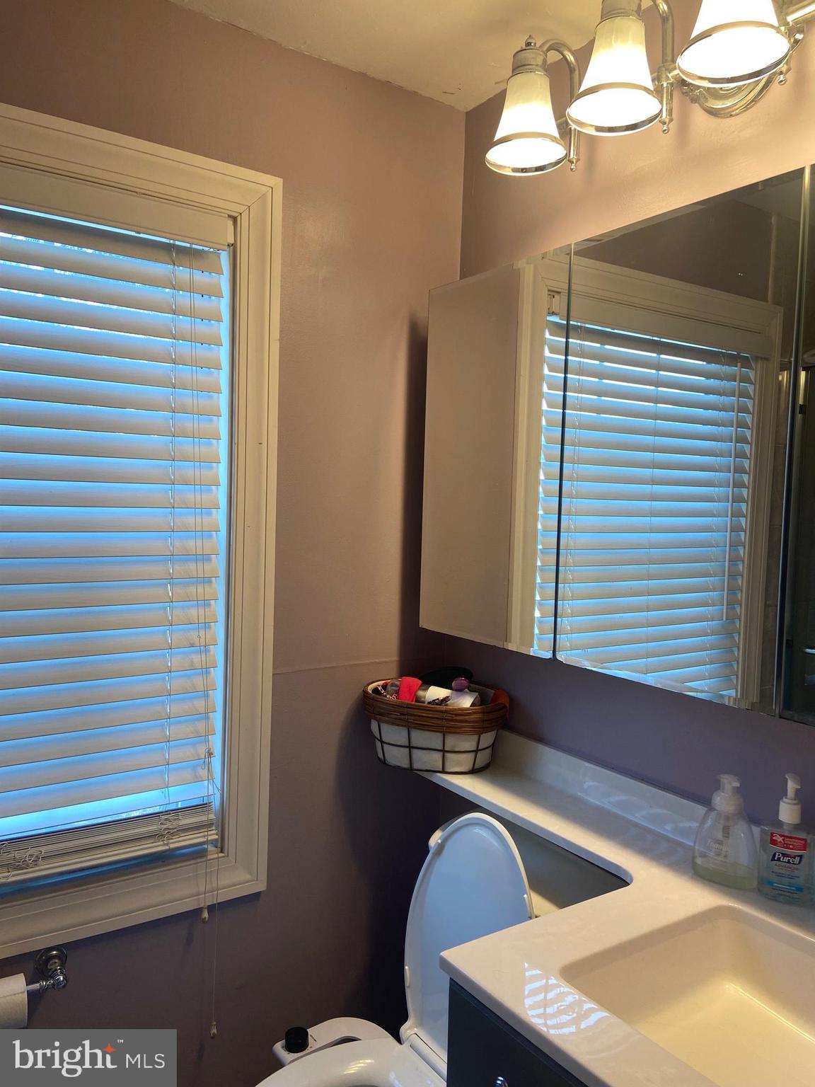1761 Aberdeen Circle Crofton, MD 21114 - Photo 20 of 33 a bathroom with a sink and a mirror